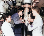 Visitors looking through the periscope of USS Macabi at Mare Island Naval Shipyard, California, United States, Armed Forces Day, 19 May 1956