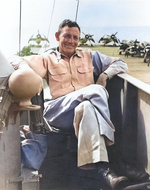 Rear Admiral Calvin T. Durgin on the bridge of his flagship, USS Makin Island, late-1944 to mid-1945; note FM-2 Wildcat and TBM Avenger aircraft on the flight deck