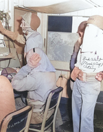 Crew members of USS Makin Island at their battle stations with inflatable belts and flash proof clothing, late 1944-mid 1945