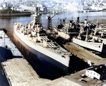 Battleship Massachusetts laid up at the Norfolk Naval Shipyard, Virginia, United States, 3 Jan 1963; note AKA-88 Uvalde at right side of photo