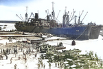 USS Aquarius (AKA-16) and USS Titania (AKA-13) unloading United States Marines at Pavuvu, Russell Islands, Solomon Islands, 28 Apr 1944