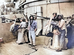 20mm Oerlikon crews at the base of one of the main turrets aboard USS North Carolina, 1942; note African-American crewmen