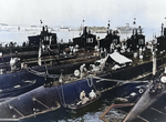 Submarines Salmon, Seal, Pickerel, Plunger, Snapper, and Permit, San Diego harbor, California, United States, 1940; note carrier Enterprise in background