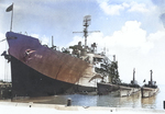 Submarine tender USS Proteus with submarines Bang, Pintado, and Pilotfish at Midway Atoll, 15 May 1944