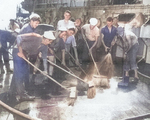 US Navy sailors scrubbing down the deck of USS IX-300 (former German cruiser Prinz Eugen) after the Baker atomic detonation of Operation Crossroads, Bikini Atoll, some days after 25 Jul 1946