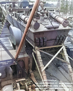 PT-109 stowed on board the Liberty Ship Joseph Stanton for transportation to the Pacific Ocean, Norfolk Navy Yard, Virginia, United States, 20 Aug 1942, photo 2 of 2