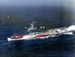 San Jacinto underway off the US east coast, 23 Jan 1944, photo 1 of 2; note SNJ training plane on flight deck