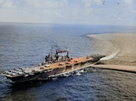 USS Saratoga underway with SBD Dauntless, F6F Hellcat, and TBF Avenger aircraft on her flight deck, 1943-1944