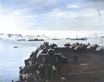 Ships in Kerama Retto anchorage near Okinawa, Japan spreading an anti-kamikaze smoke screen, 3 May 1945, as viewed from USS Sargent Bay. Note TBM Avenger and FM-2 Wildcat aircraft in foreground.