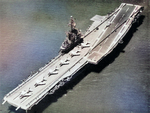 USS Ticonderoga with sailors, F3H Demon fighters, and HUP Retriever helicopter lined up on the flight deck, circa 1959