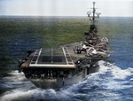 View of USS Ticonderoga from an aircraft approaching for landing, 1957; note A3D-2 Skywarrior aircraft on the flight deck