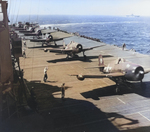 F6F Hellcat aircraft preparing for takeoff from Ticonderoga for strikes in Manila Bay, Philippine Islands, 5 or 6 Nov 1944; note two leading planes were F6F-5N nightfighters with wing-mounted radar