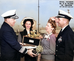 RAdm Mahlon Tisdale presenting champagne bottle to Mrs Davenport to christen Trepang, Mare Island Naval Shipyard, California, United States, 23 Mar 1944; Mrs Garvey and Cmdr Roy Davenport also present