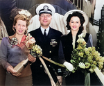 Commander Roy Davenport with his wife (with bottle) and Mrs. Garvey at the christening of submarine Trepang, Mare Island Naval Shipyard, California, United States, 23 Mar 1944