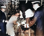 Mrs. Frederick Crisp christening submarine Tunny, Mare Island Naval Shipyard, Vallejo, California, United States, 30 Jun 1942; Commander Lemuel Padget and Rear Admiral W. L. Friedell were also present