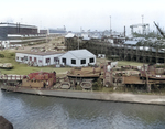 USS Ballard at Mare Island Navy Yard, Vallejo, California, United States, 5 Jan 1942; note submarines under construction, probably Wahoo and Whale