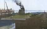 USS Wolverine during her fitting out period, summer 1942; note steamer Greater Buffalo nearby