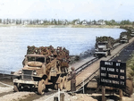 US Army CCKW 2 1/2-ton cargo trucks crossing the Rhine River near Mainz, Germany, Mar or Apr 1945; the passengers were possibly German POWs