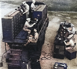 High-angled view of a GMC CCKW 2 1/2-ton 6x6 truck converted to serve as a spectacle workshop; some 15% of US soldiers used glasses in the war