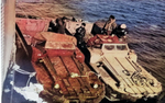 Two DUKWs lining up while awaiting supplies for transportation ashore, date unknown