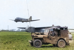 C-47 Skytrain with hook lowered preparing to snatch CG-4 glider as the Control Team stands by in a GPW/MB Jeep, date unknown