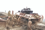 M10 Wolverine tank destroyer of US 773rd Tank Destroyer Battalion crossing the Saar River outside Dillingen, Germany, Dec 1944