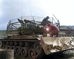 M46 medium tank of US 1st marine Tank Battalion, Korea, 25 Mar 1953; note bulldozer attachment and anti-rocket wire screen