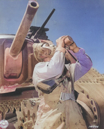 Corporal Philip Margherito of HQ Company, US 752nd Tank Battalion drinking water during a M3 medium tank training mission, Desert Training Center, Indio, California, United States, 10 Jun 1942