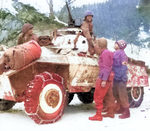 M8 armored car of US 11th Armored Division with men of US 84th Infantry Division in Noville, Belgium, 16 Jan 1945