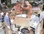 Servicing the engine of a M8 armored car, date unknown