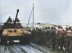 American prisoners of war being marched past a German Tiger II heavy tank, 1944