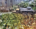 Crowd of British factory workers checking out the Valentine tank named 