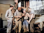 African-American US Marine Robert Stockman showing US Coast Guardsmen his M1 Carbine aboard an USCG ship, Feb 1944