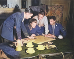 Allied Operation Jedburgh personnel receiving instructions from a briefing officer, London, England, United Kingdom, circa 1944; note M1 Carbine on table