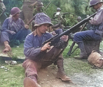 US Army Pfc. Edward J. Foley of the 143rd Infantry Regiment of the 36th Division cleaning his Springfield M1903A4 sniper rifle, near Valletri, Italy, 29 May 1944