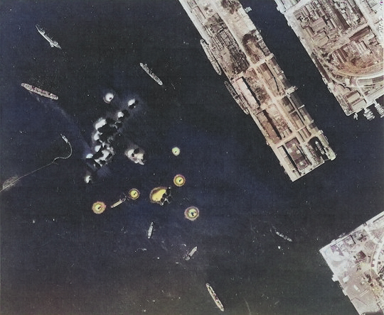 Takao (now Kaohsiung) harbor under US aerial attack, Taiwan, 17 Nov 1944, photo 1 of 5 [Colorized by WW2DB]