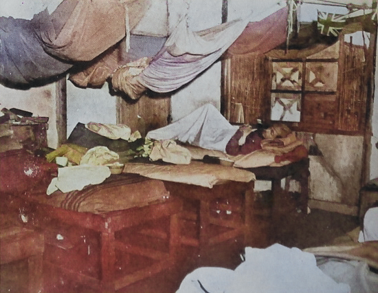 Interior of a Japanese prisoner of war camp for American captives, Taiwan, 5 Sep 1945 [Colorized by WW2DB]