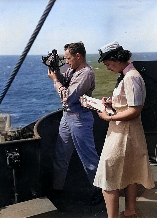 A WAVES ensign timing the sights for USS General Omar Bundy's navigation officer en route to Pearl Harbor, US Territory of Hawaii, 25 Jun 1945 [Colorized by WW2DB]