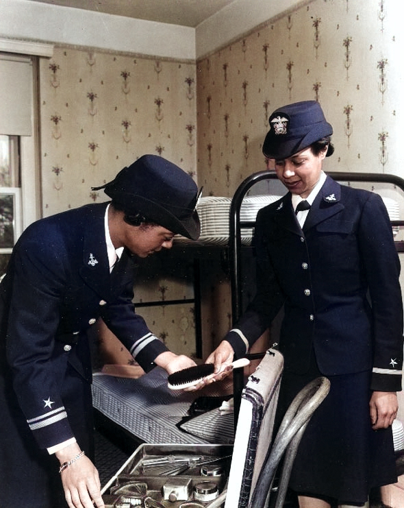 WAVES Lieutenant (jg) Harriet Ida Pickens and Ensign Frances Wills packing following graduation from the Naval Reserve Midshipmen's School, Northampton, Massachusetts, United States, circa Dec 1944 [Colorized by WW2DB]