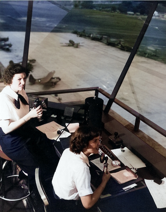 WAVES Specialist (T) 3rd Class Dorothy Knee and Specialist (T) Genevieve Close directing air traffic at Naval Air Station, Anacostia, District of Columbia, United States, in early or mid-1943 [Colorized by WW2DB]