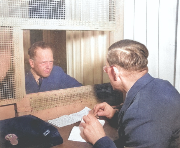 German Field Marshal Erhard Milch meeting with his brother and defense counsel Dr. Werner Milch during his war crimes trial, Nuremberg, Germany, early 1947 [Colorized by WW2DB]