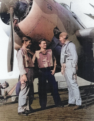 Aviation Radioman 1st Class E. L. Feehan, Aviation Ordnanceman 2nd Class S. J. Pocotny, and Lieutenant Commander J. J. Lynch aboard USS Coral Sea, 30 Oct 1943 [Colorized by WW2DB]