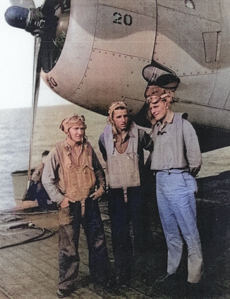 Aviation Machinist's Mate 3rd Class D. E. Ritch, Aviation Radioman 3rd Class R. L. Burgess, and Ensign C. R. Rasmussen aboard USS Coral Sea, 30 Oct 1943 [Colorized by WW2DB]