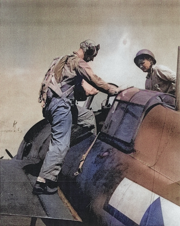 Lieutenant (jg) Lewis entering a F4F Wildcat fighter aboard USS Anzio, Pacific Ocean, 23 Feb 1945 [Colorized by WW2DB]