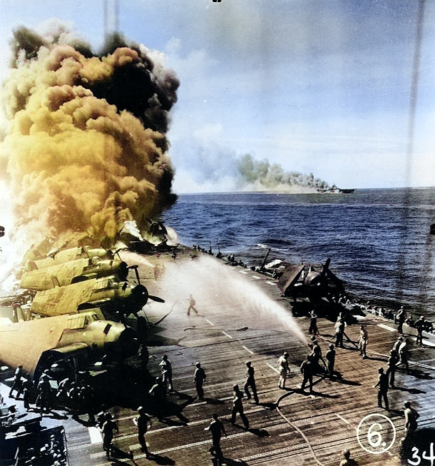 Firefighters of Belleau Wood fighting flames caused by a special attack aircraft, in the Philippine Islands, 30 Oct 1944; note TBM Avenger aircraft on flight deck and Franklin burning in distance. Photo 1 of 2 [Colorized by WW2DB]