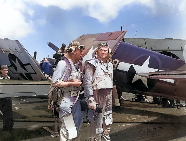 Two US Navy fighter pilots aboard carrier Enterprise during the raid on Truk Atoll in the Caroline Islands, 16 Feb 1944 [Colorized by WW2DB]