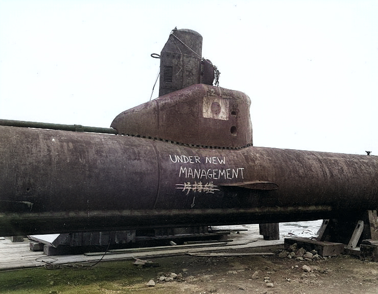 A Kairyu-class submarine at Yokosuka Naval Base, Japan, 7 Sep 1945; note grafitti drawn by American personnel [Colorized by WW2DB]