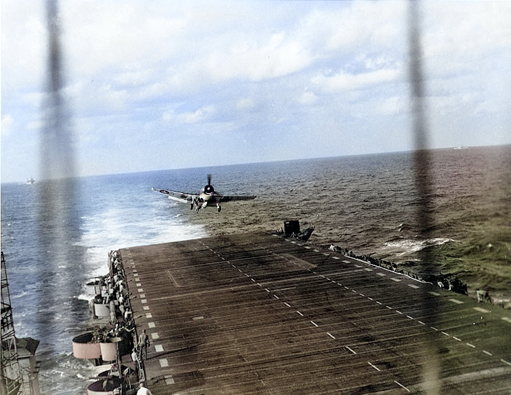 F6F Hellcat fighter landing on USS Langley, Ryukyu Islands, Japan, 10 Oct 1944 [Colorized by WW2DB]