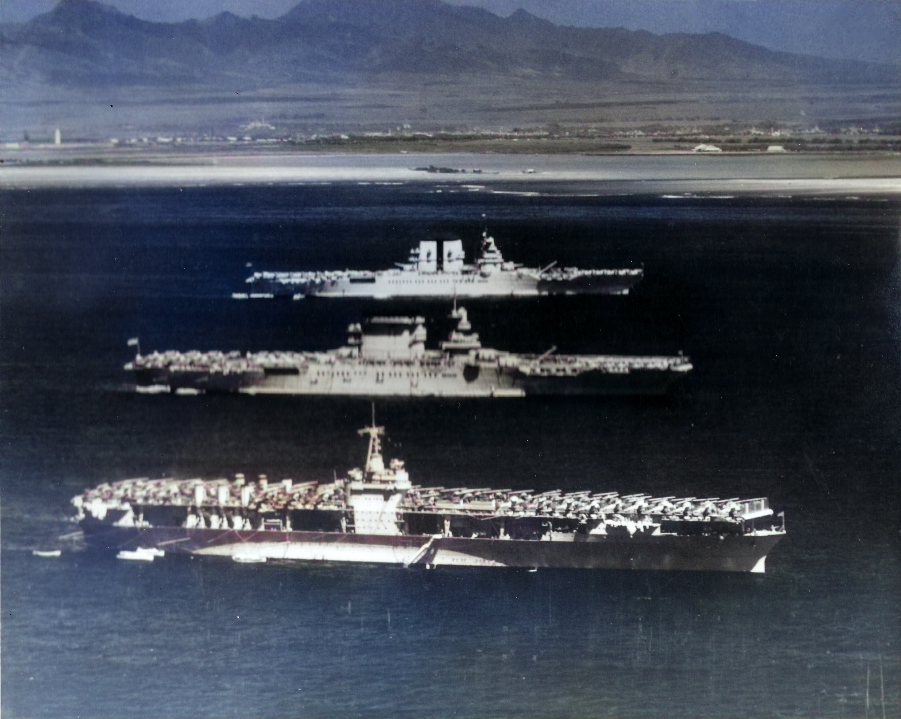 USS Ranger (foreground), USS Lexington (center), and USS Saratoga (background) at anchor off Honolulu, US Territory of Hawaii, 8 Apr 1936 [Colorized by WW2DB]