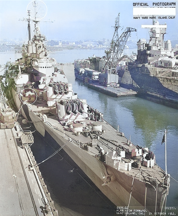 USS Montpelier at Mare Island Navy Yard, California, United States following overhaul, 21 Oct 1944; USS Indianapolis in background [Colorized by WW2DB]